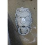 A concrete lion wall mask