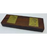 A rosewood and brass stamp box