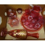 A box of cranberry glass, a circular tray, jug, cups, vase, Mary Gregory style beakers, etc.