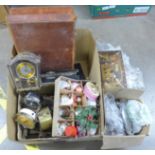 Flatware, a cuckoo clock, other clocks, tins, Christmas decorations, etc. **PLEASE NOTE THIS LOT