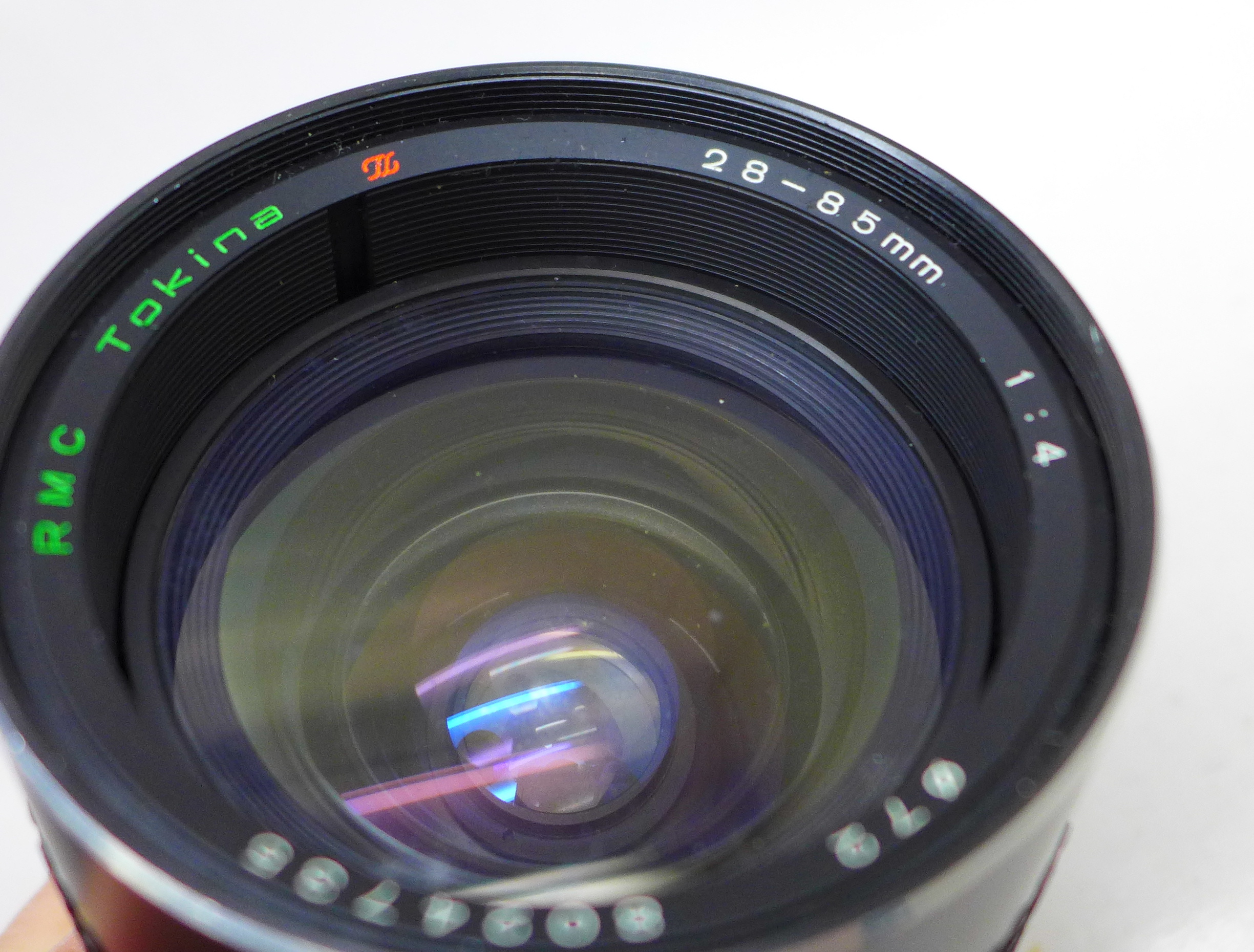 A Tokina 28-85mm 1:4 camera lens for a Nikon NA1 mount and a pair of Jessops 12x50 binolcuars - Image 2 of 2