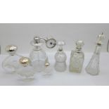 Three silver mounted glass scent bottles including one thistle shaped and hallmarked Birmingham