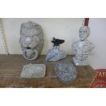 A concrete lion wall mask and a concrete bust of a goblin, an English Bull Terrier concrete plaque