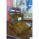 A Victorian oak table top stationery cabinet