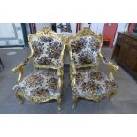 A pair of French Louis XV style giltwood and fabric upholstered fauteuils