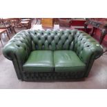 A green leather Chesterfield settee