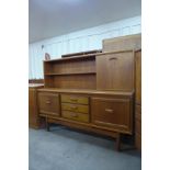 A teak highboard