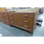 A teak chest of drawers