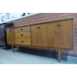 A teak cocktail sideboard