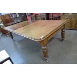 A large Victorian mahogany extending dining table