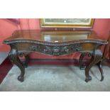 A George IV Irish carved mahogany serpentine console table