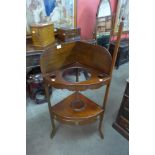 A George III mahogany corner washstand