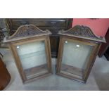 A pair of 19th Century carved walnut wall hanging cabinets