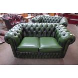 A green leather Chesterfield settee