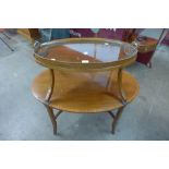 An Edward VII mahogany and satinwood inlaid oval two tier etergere