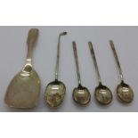 A Georg Jensen silver caddy spoon, London import mark for 1928, a silver golf teaspoon and three