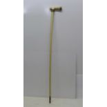 A 19th Century marine bone walking cane with ivory handle and with gilt metal mounts, 83cm