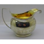 A George III silver jug with gilt interior, London 1806, 118g