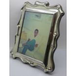 A silver photograph frame, height 24.5cm