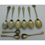 A collection of silver spoons including condiment spoons and a Rolex spoon, 78g of silver