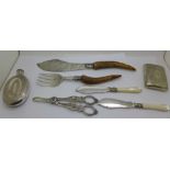 A plated flask, fish servers with antler handles, grape scissors, etc.