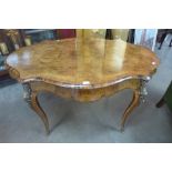 A Victorian walnut, burr walnut and gilt metal mounted serpentine centre table