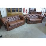 A pair of brown leather Chesterfield settees