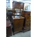 A small oak cabinet and a sewing box