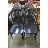 A set of four beech wheelback chairs