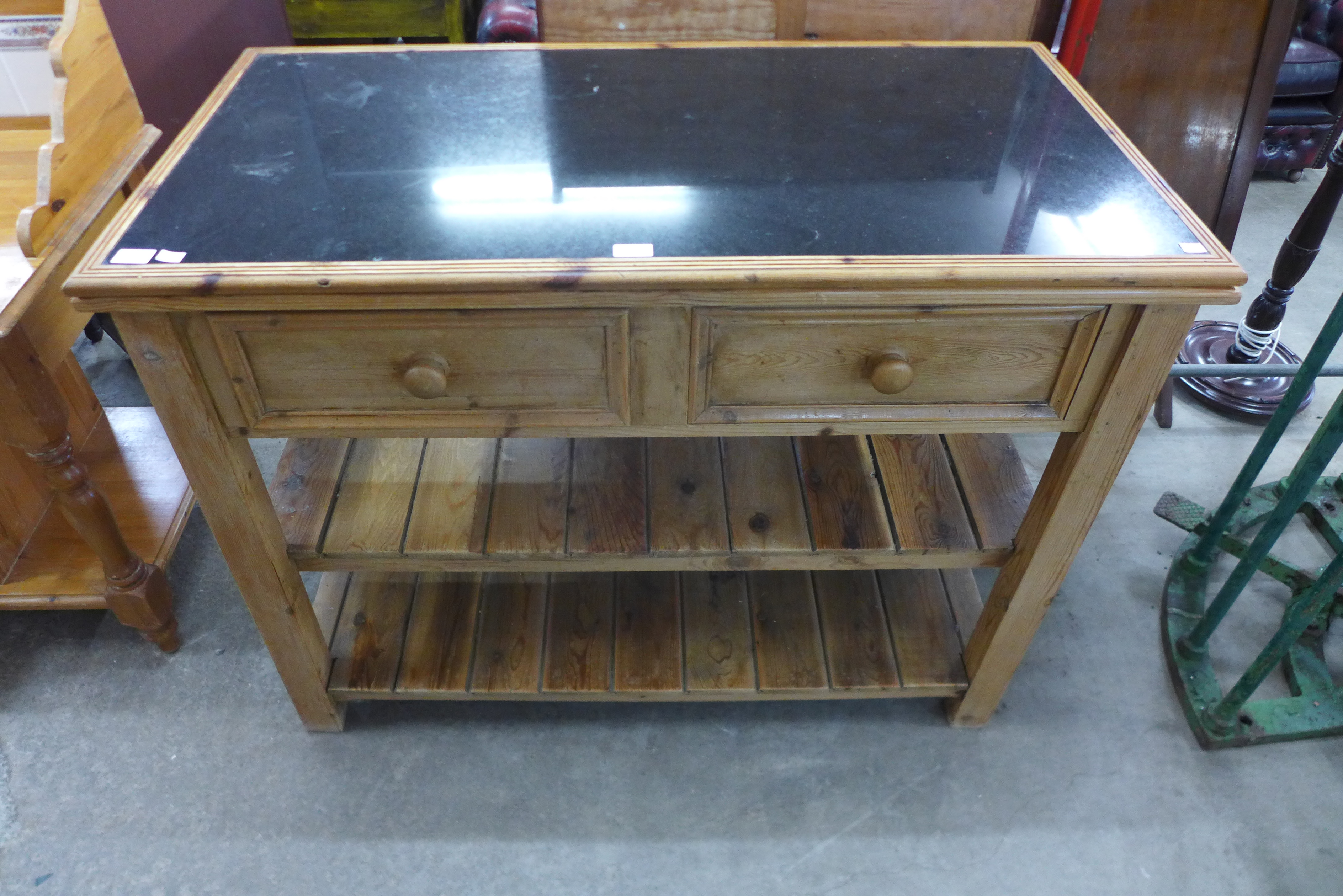 A Victorian style pine and granite topped kitchen serving table