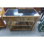 A Victorian style pine and granite topped kitchen serving table