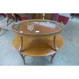 An Edward VII mahogany and satinwood inlaid oval two tier etergere