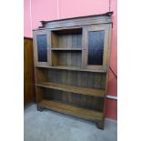 An Arts and Crafts oak open bookcase