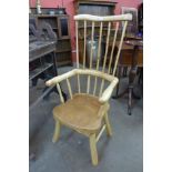 A primitive yew wood highback armchair