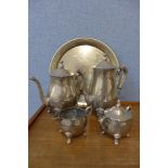 A white metal four piece tea and coffee service and a tray