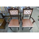 A pair of Edward VII mahogany and fabric upholstered armchairs