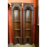 A pair of 18th Century Baroque style carved oak architectural freestanding corner cabinets