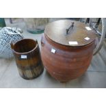 A terracotta lidded pot and a coopered pine churn