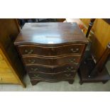 A George III style mahogany serpentine bachelor's chest of drawers