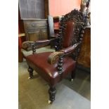 A Victorian Jacobean Revival carved oak armchair