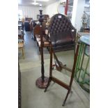 A mahogany cheval mirror and a carved standard lamp