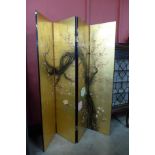 A Chinese chinoiserie lacquered four panel folding dressing screen