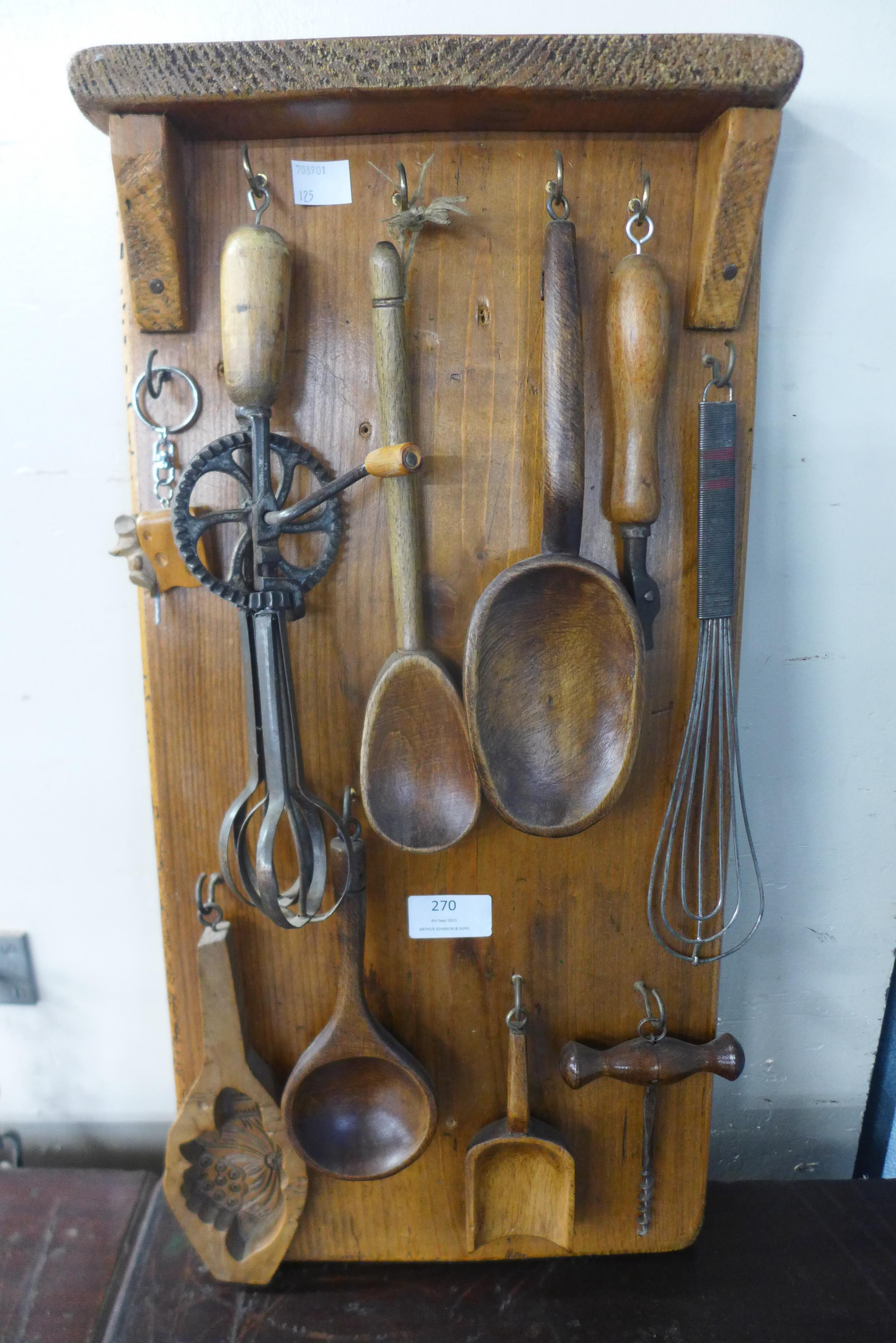 A pine display rack including vintage kitchenalia