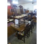 An oak draw-leaf table and four chairs