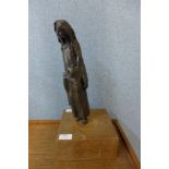 A British School metal sculpture of a girl with handbag, on a wooden plinth, a/f