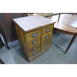 An early/mid 20th Century beech eight drawer filing cabinet