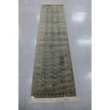 An Eastern green ground runner rug