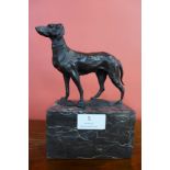 A small French style bronze figure of a dog on black marble socle