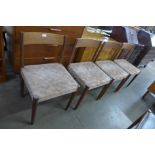 A set of four Danish teak dining chairs