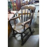 A Victorian child's elm and beech rocking chair